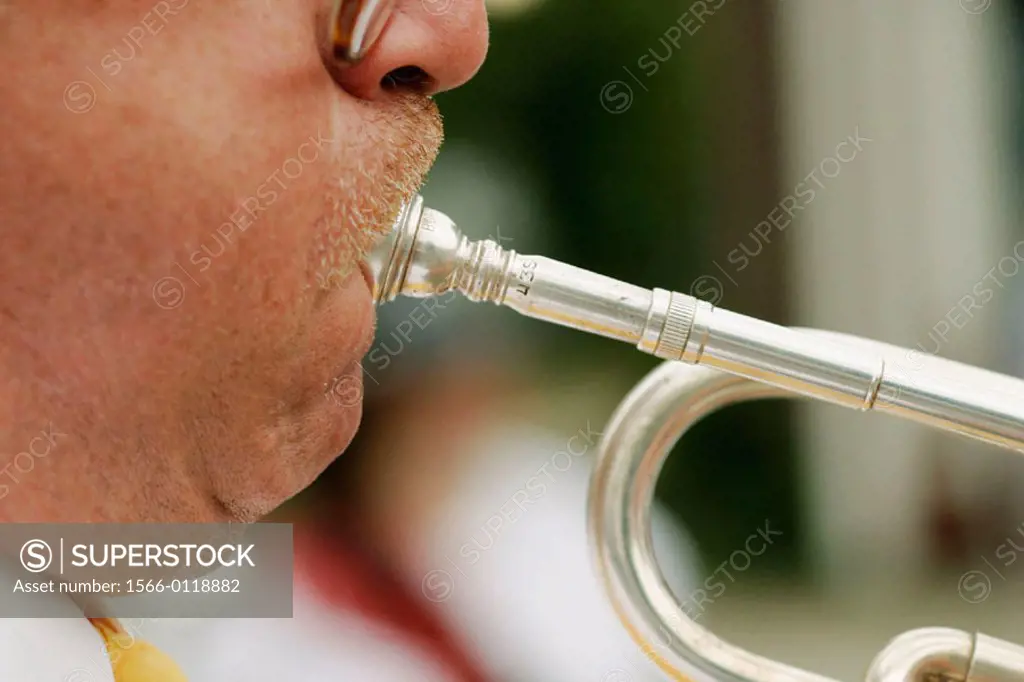 Man blowing into mouthpiece