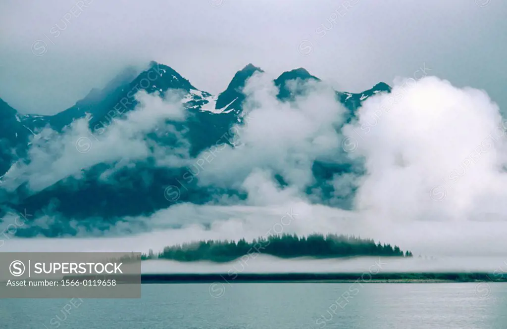Clouds over the mountains. Glacier Bay. Glacier Bay National Park. Alaska. USA