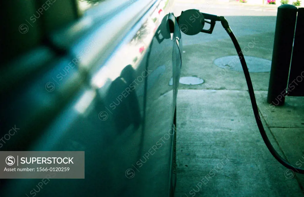 Car filling up with gasoline