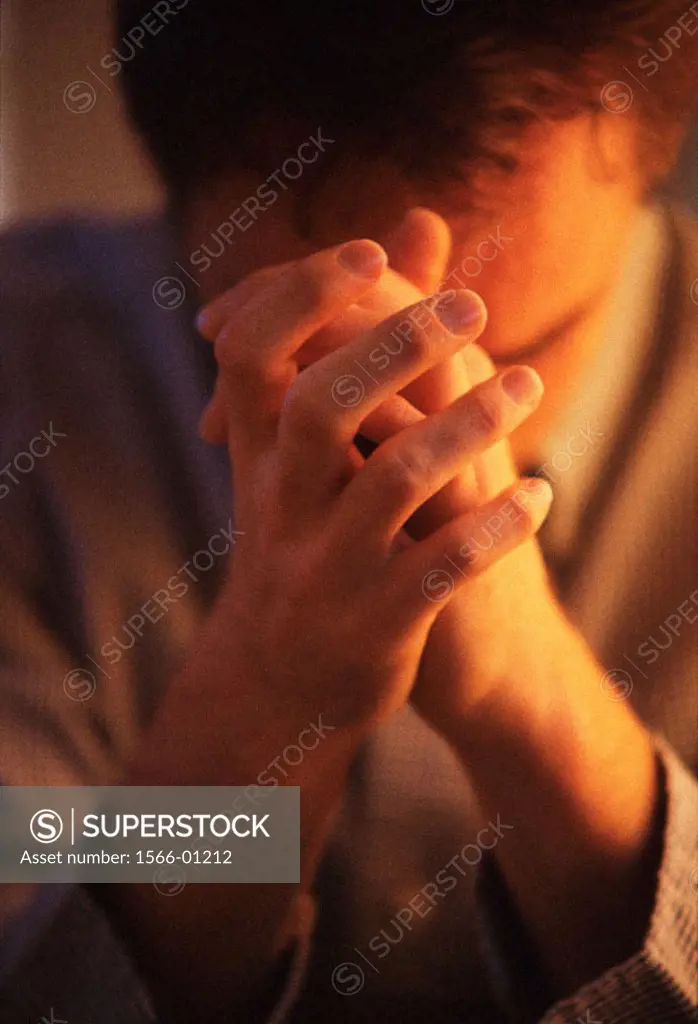 Man with hands folded