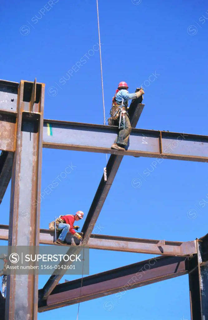 Ironworkers hanging structural steel