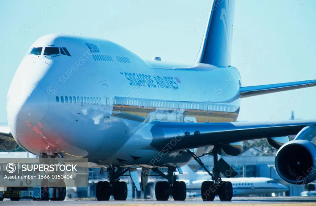 Push truck towing Boeing 747 passenger aircarft