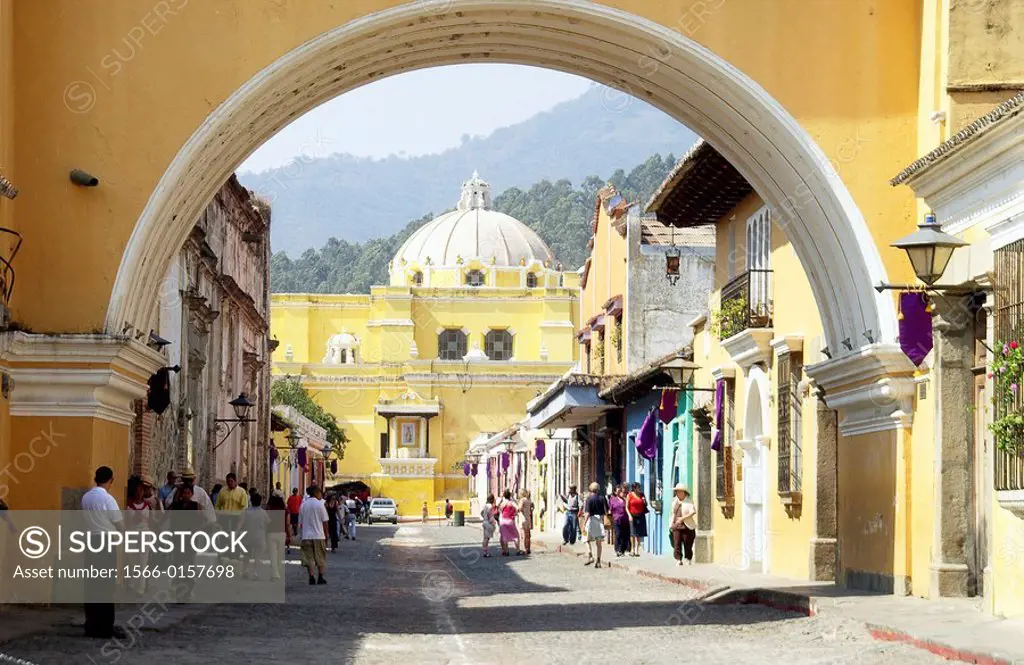 Santa Catalina Arch and Nuestra Señora de la Merced church in background. Antigua Guatemala. Guatemala