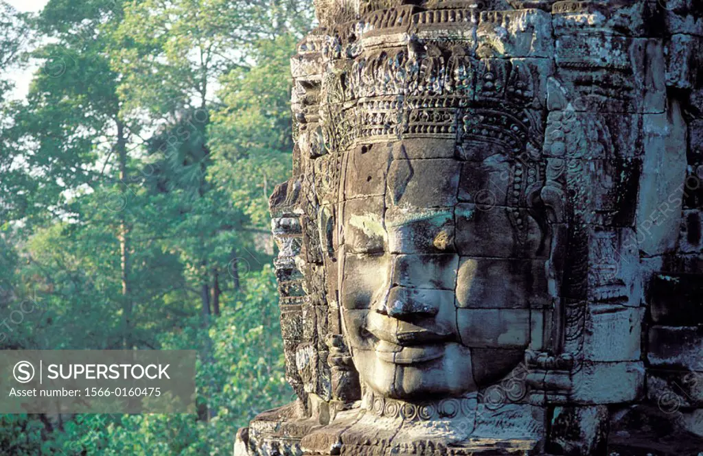 Buddha face carved in stone. Temple of Bayon, complex of Angkor Thom. Angkor. Cambodia