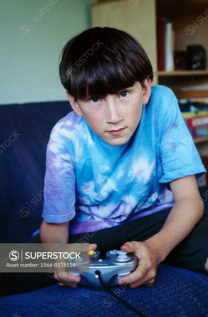 Boy plays videogame