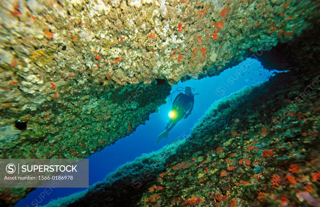 Cave and diver, Mediterranean Sea