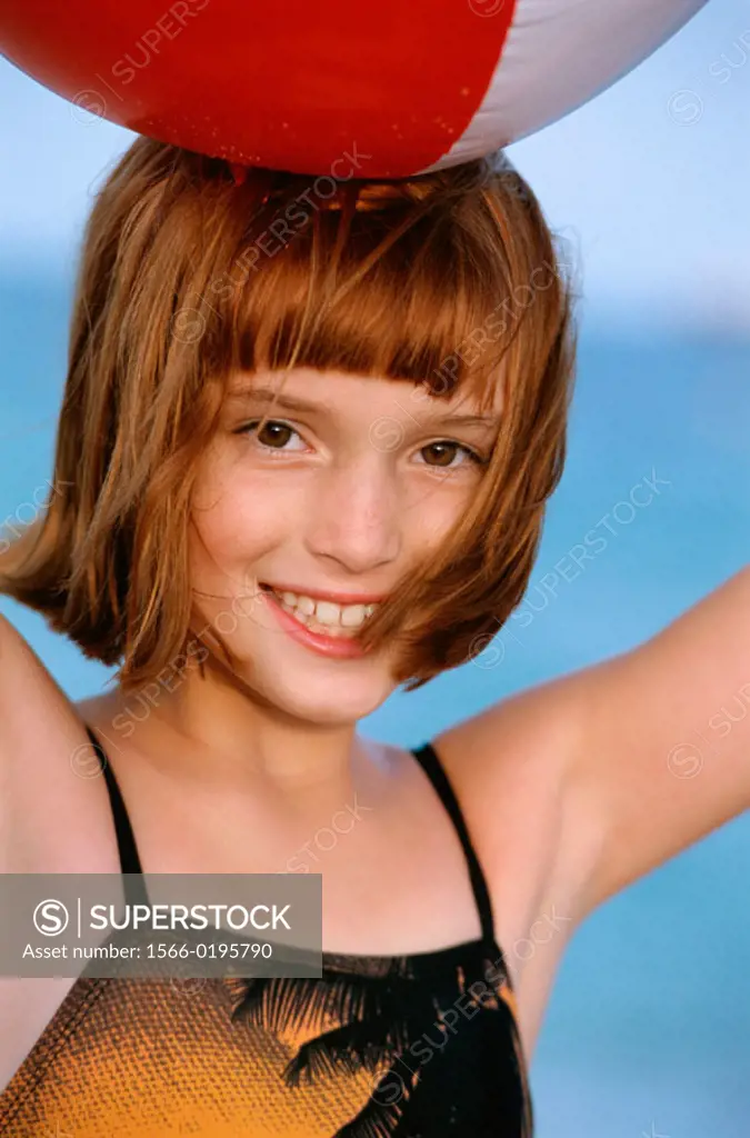 girl with a beachball on her head