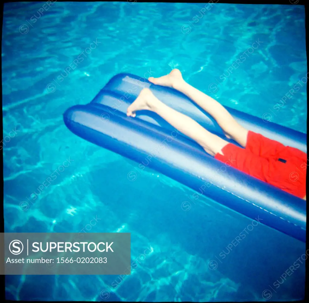 Airbed in swimming pool