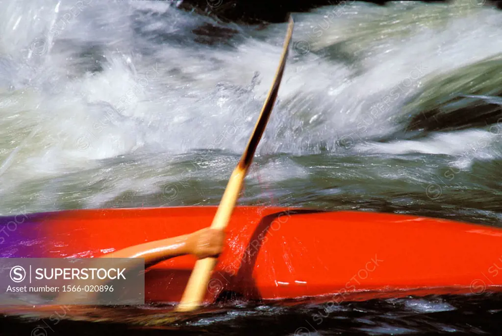 A kayaker goes underwater on the Payette River. Idaho. USA