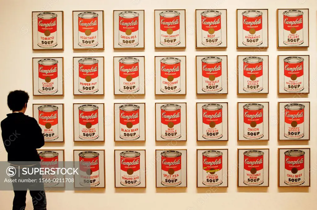 Visitor looking at Campbell´s Soup cans by Andy Warhol, Museum of Modern Art. New York City. USA