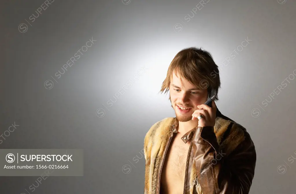 Young man talking on cellular telephone