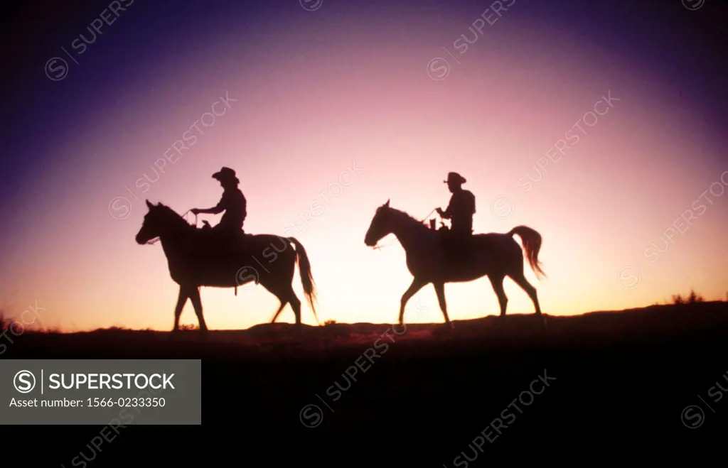 Rancher couple on horseback