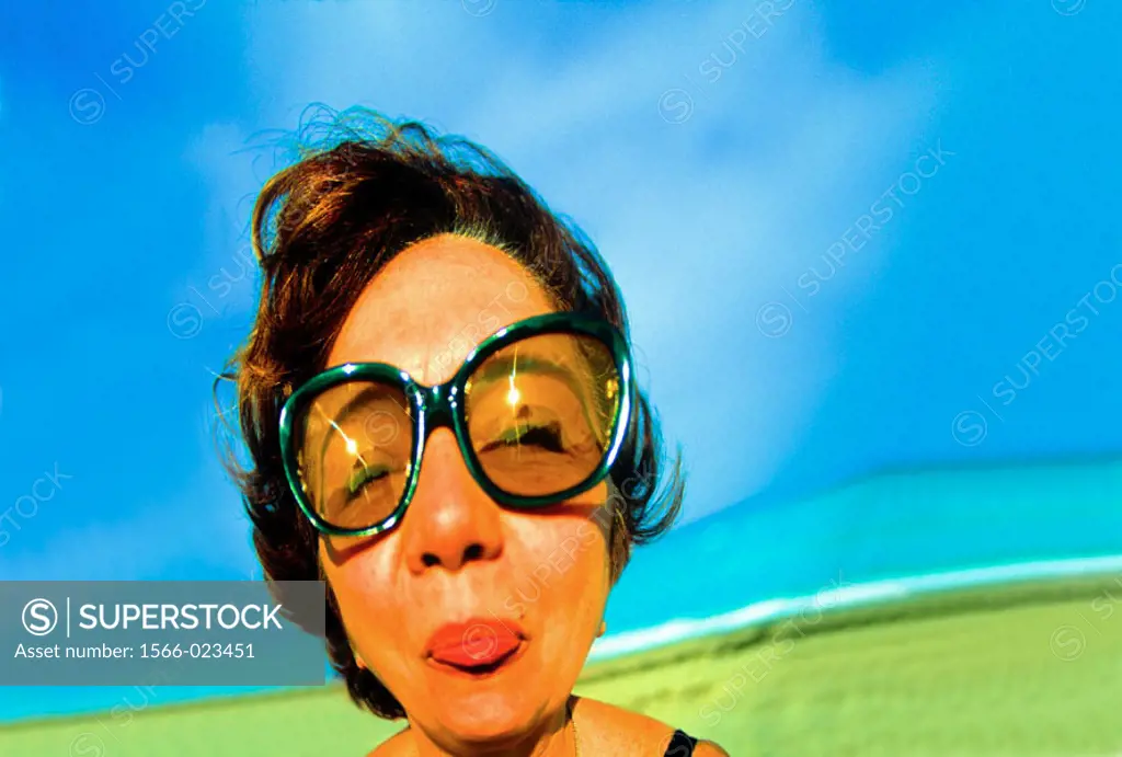 Distorted woman´s face with sun glasses