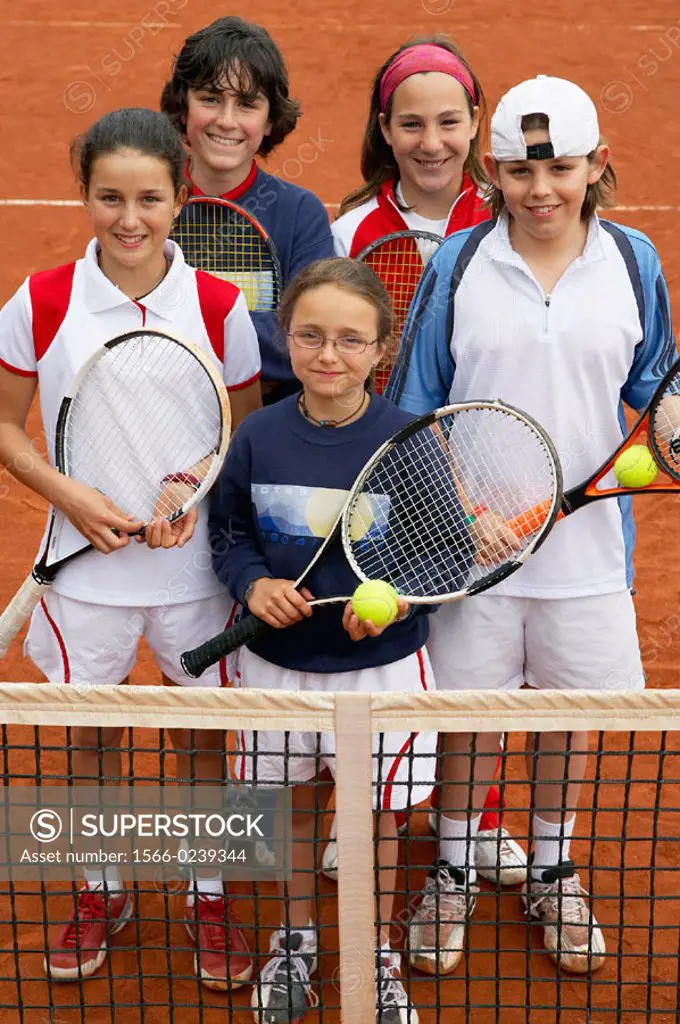 10-15 year old children in clay court, tennis school. Royal Tennis Club of San Sebastian, Euskadi, USA