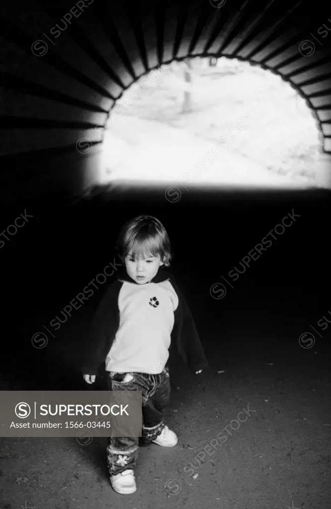 Child in a tunnel