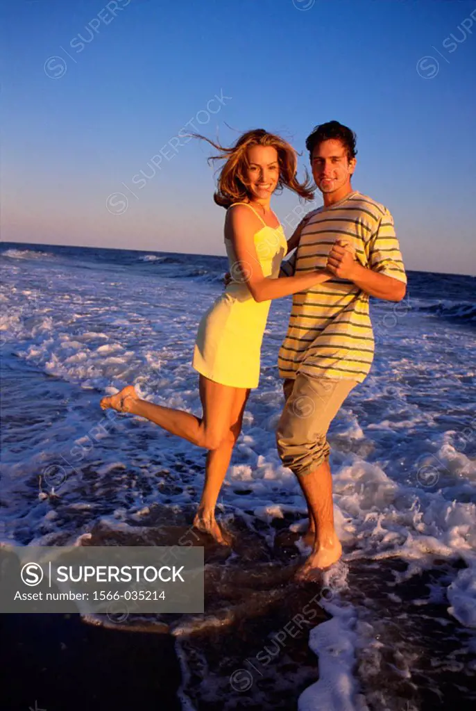 Couple dancing on a beach