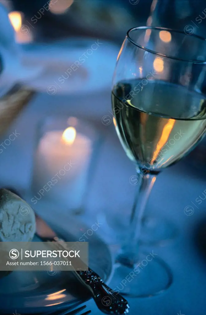 Wine glass and candlelight