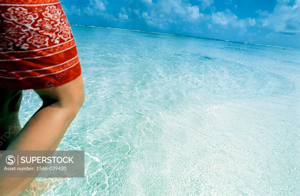 Woman´s legs in ocean. Cook Islands