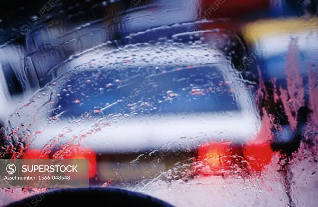 Car seen through a monsoon windshield