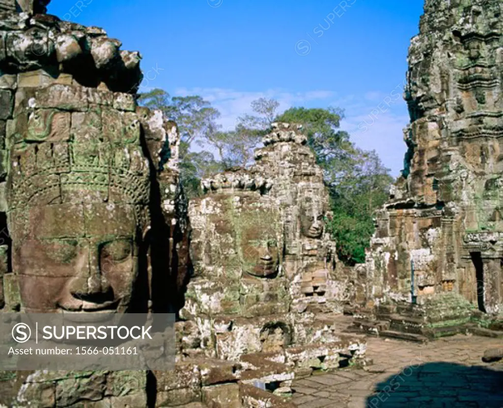 Faces of smiling Buddah statues at temple complex of Angkor Thom. Angkor. Cambodia