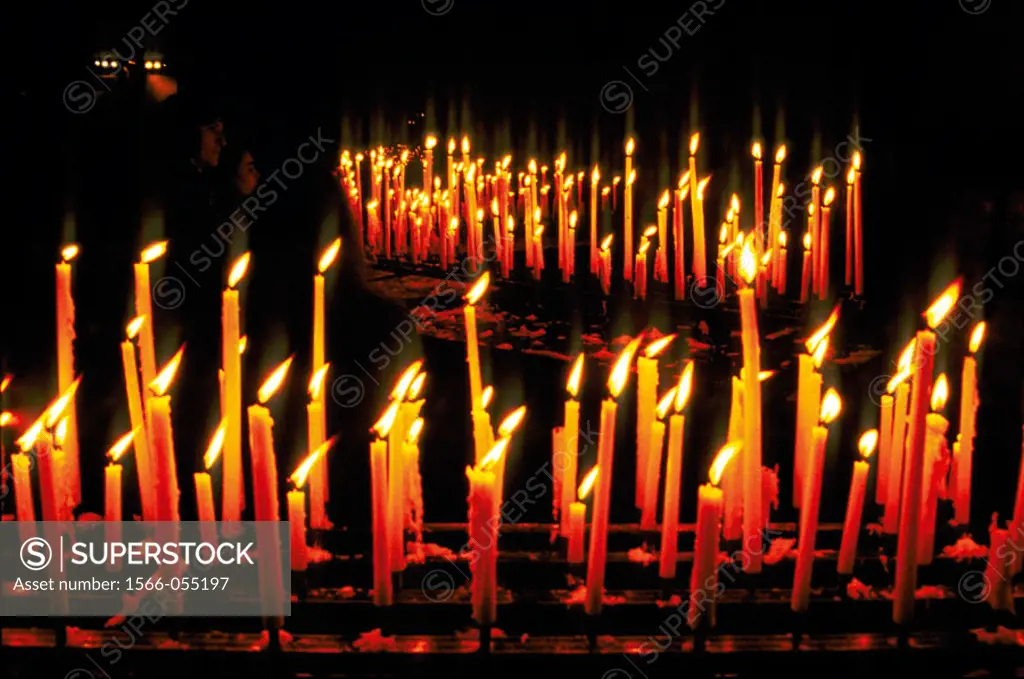 Burning candles in Notre Dame cathedral. Paris. France