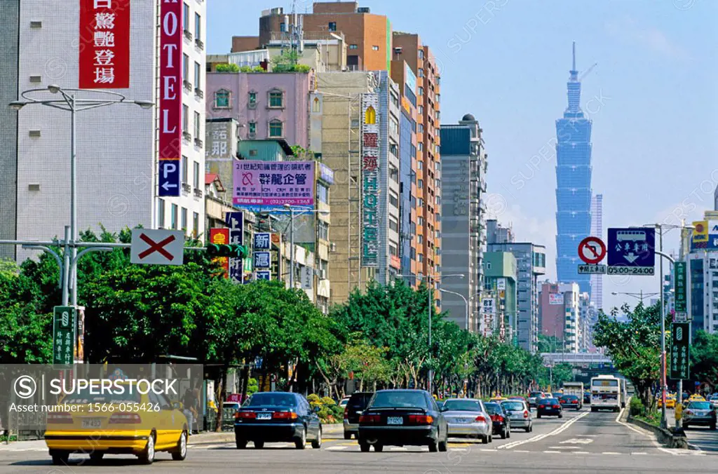 Street and traffic with Taipei 101 tower in background. Taipei. Taiwan