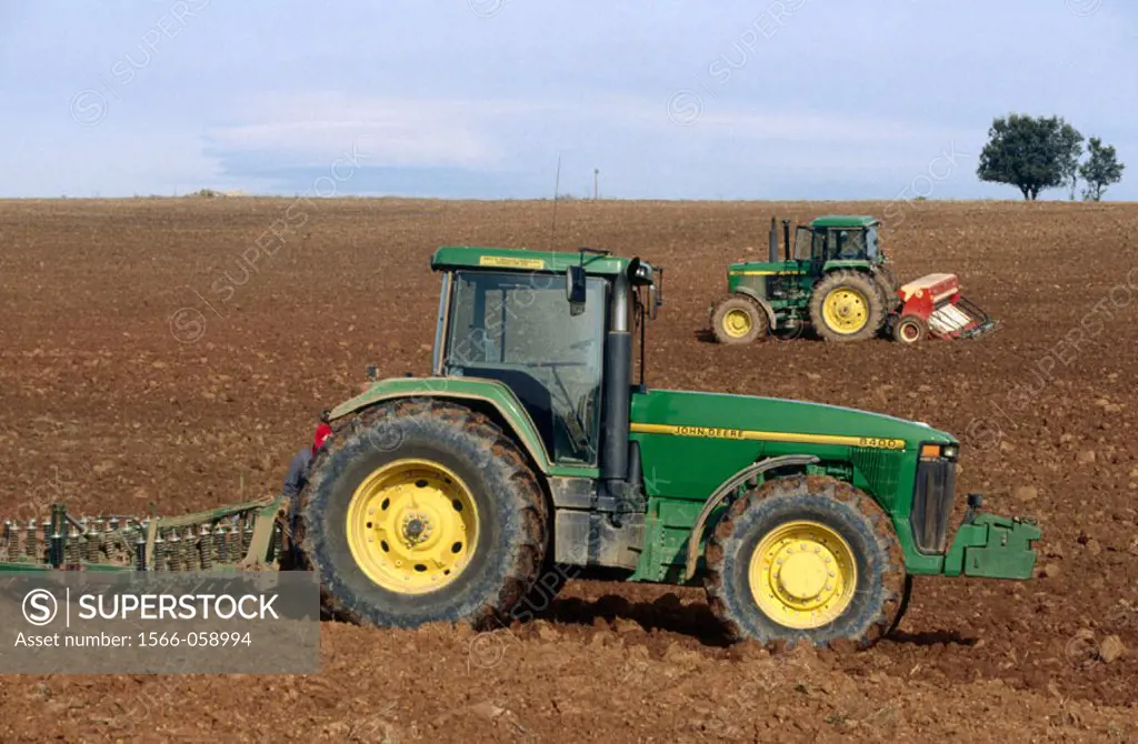 Tractor ploughing field. Spain