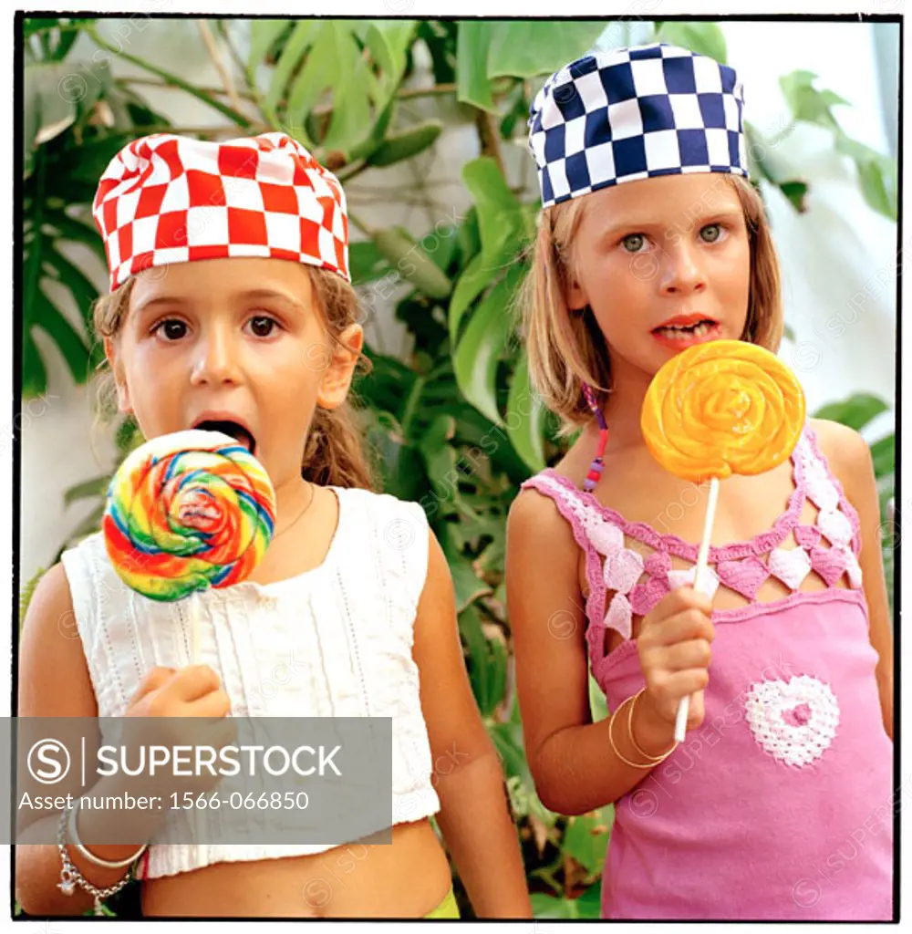 Girls eating lollipops