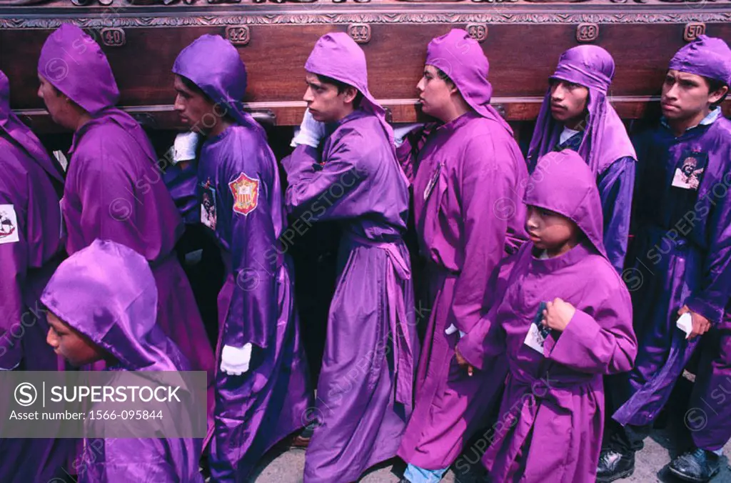 Penitents during Holy Week procession. Antigua Guatemala. Guatemala