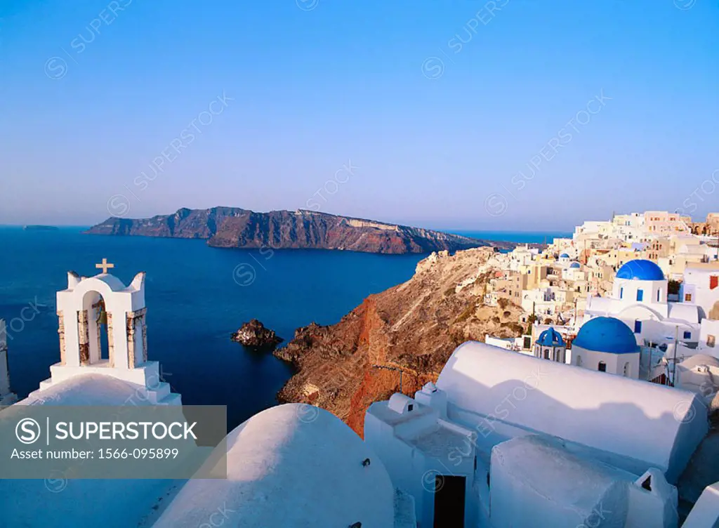 Greece, Cyclades Islands, Santorini, Oia village, White Churches with blue dome in front of the sea.