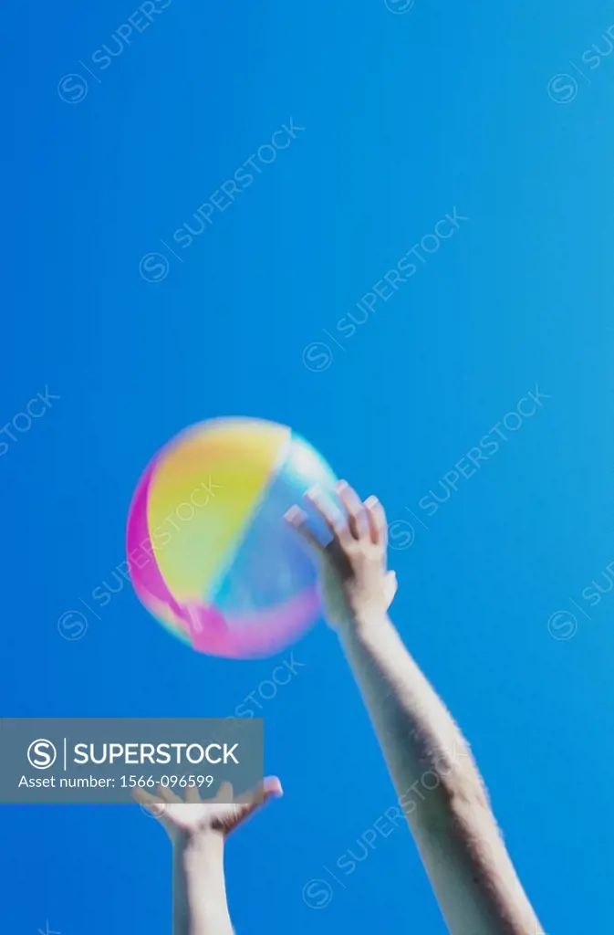 Child catching a beach ball