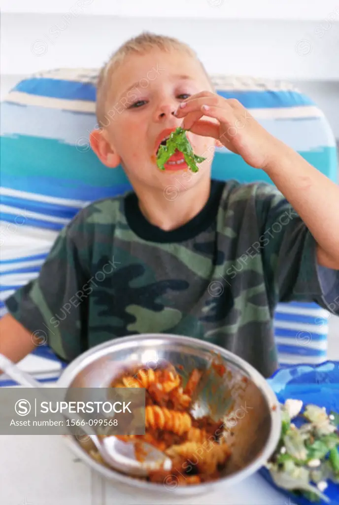 Boy eating italian food