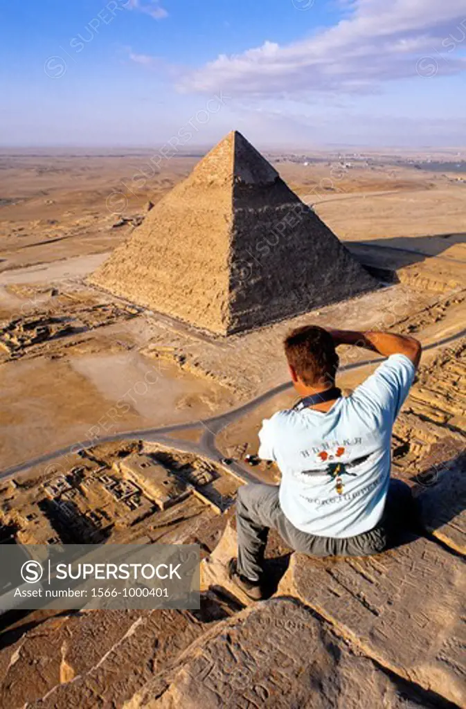 Climbing on the pyramids which is strictly forbidden and dangerous Gizeh Cairo suburbs Egypt