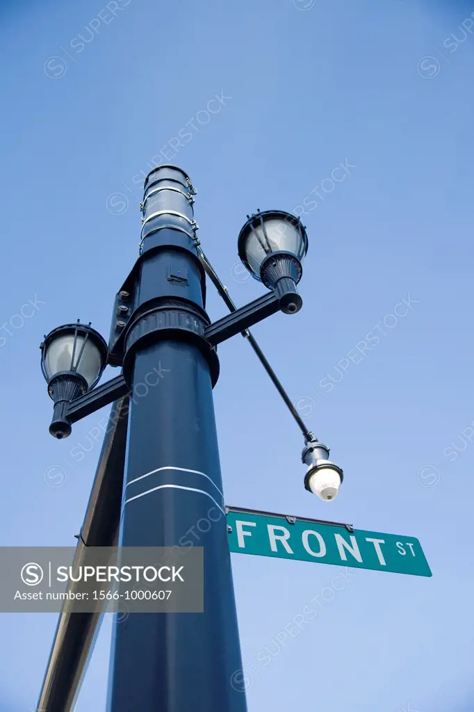 Streetlamps and a ´Front Street´ sign on a lamppost