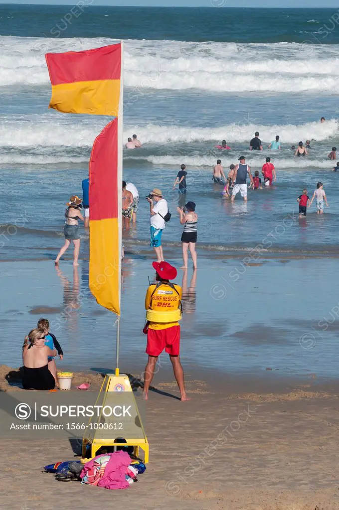 Lifesavers and swimmers confront heavy surf at Coolum Beach on Queensland´s Sunshine Coast during the Christmas summer holidays