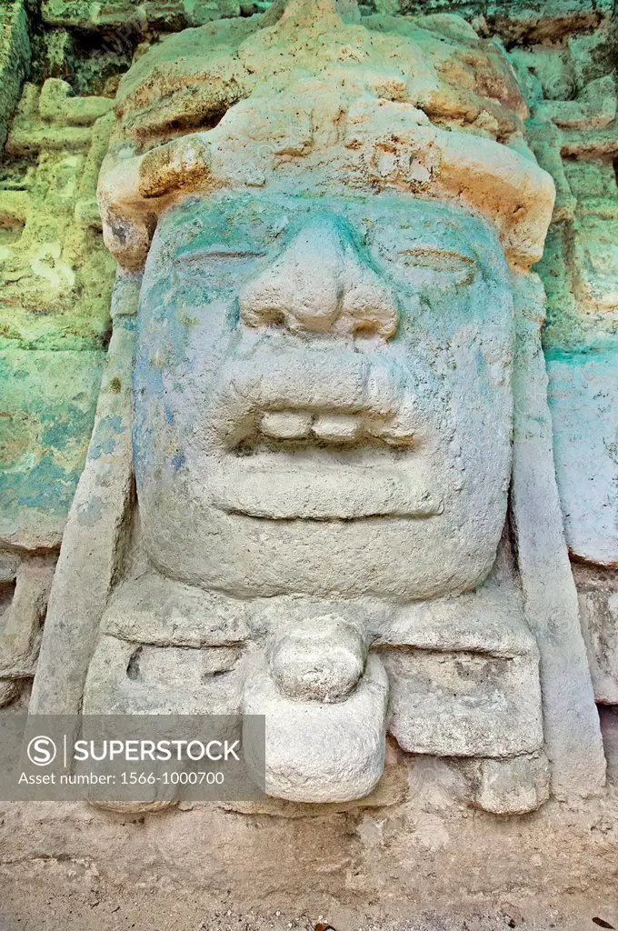 Mask of a human head with cocodrile headdress Temple of the Masks Temple N9-56 Maya temple ruins at Lamanai 300BC - 1500AD Lamanai Belize.