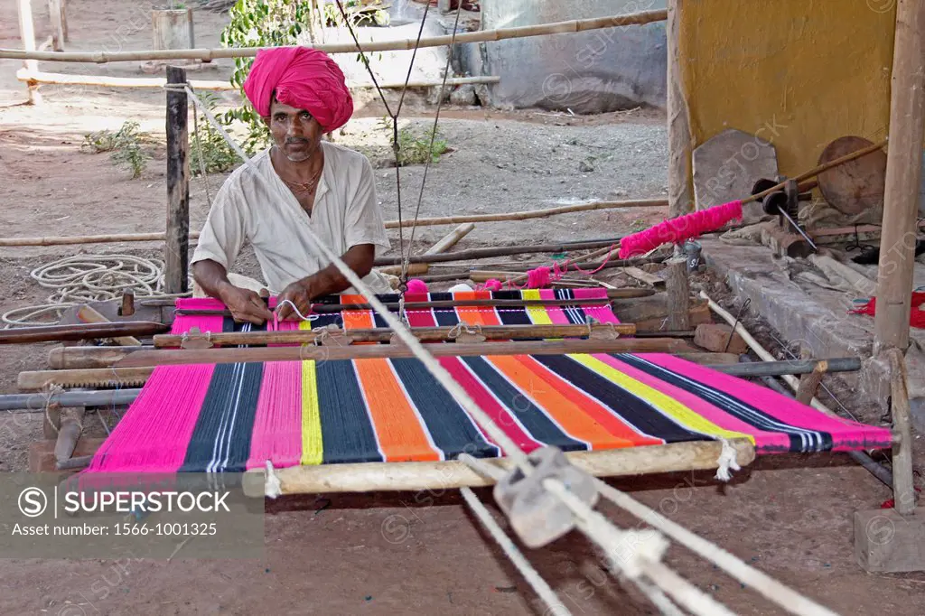 Man Making Ghongadi, desi blanket from sheep wool, Hand-made Multicolor Woolen Blanket, India