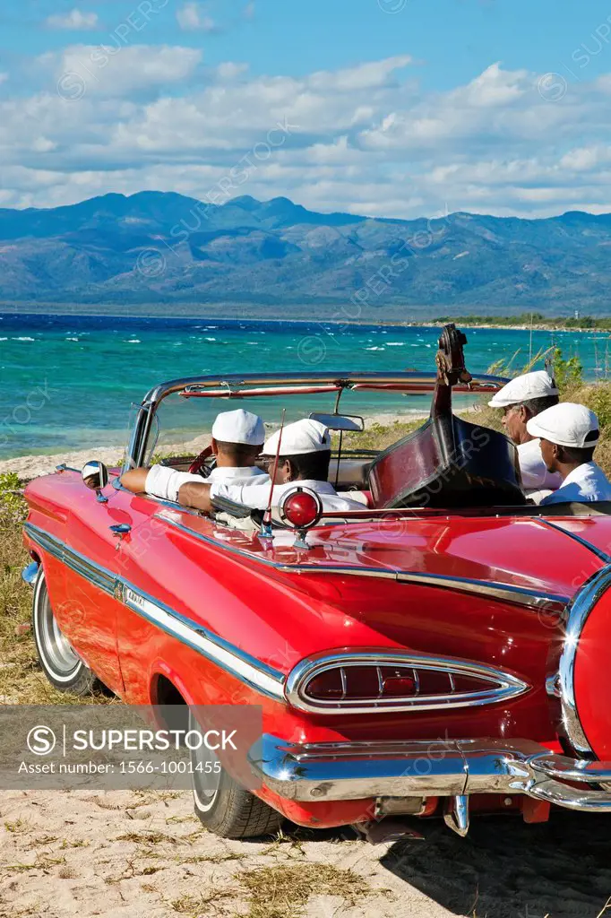 Ancon beach, Classic car and music band , Trinidad city, Sancti Spiritus Province, Cuba.