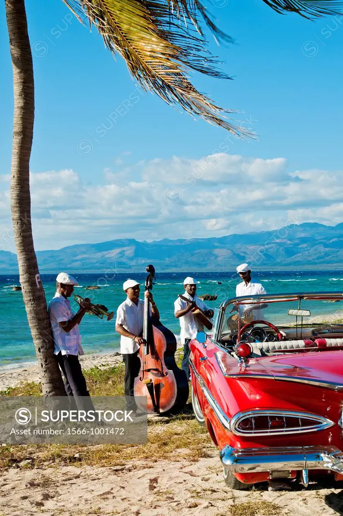 Ancon beach, Classic car and music band , Trinidad city, Sancti Spiritus Province, Cuba.