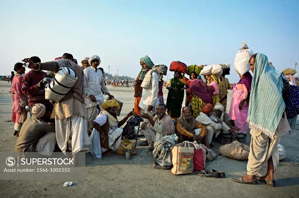 Pilgrims gathering for bathing at the confluence of the river Ganges and the Bay of Bengal , Sagar Mela, India, Ganges River.