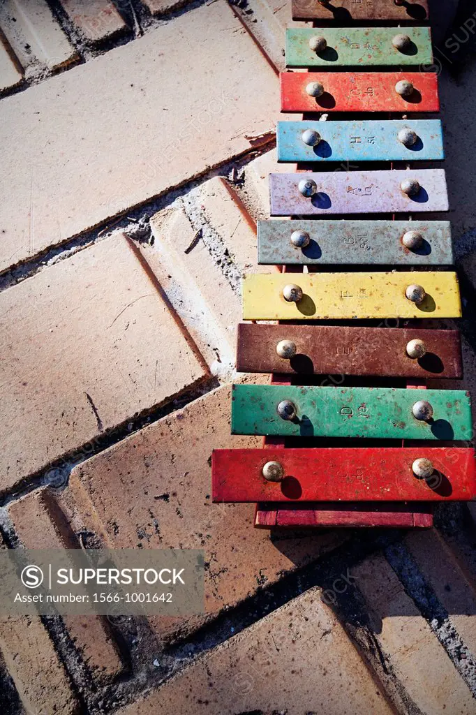 Coloured xylophone on the floor