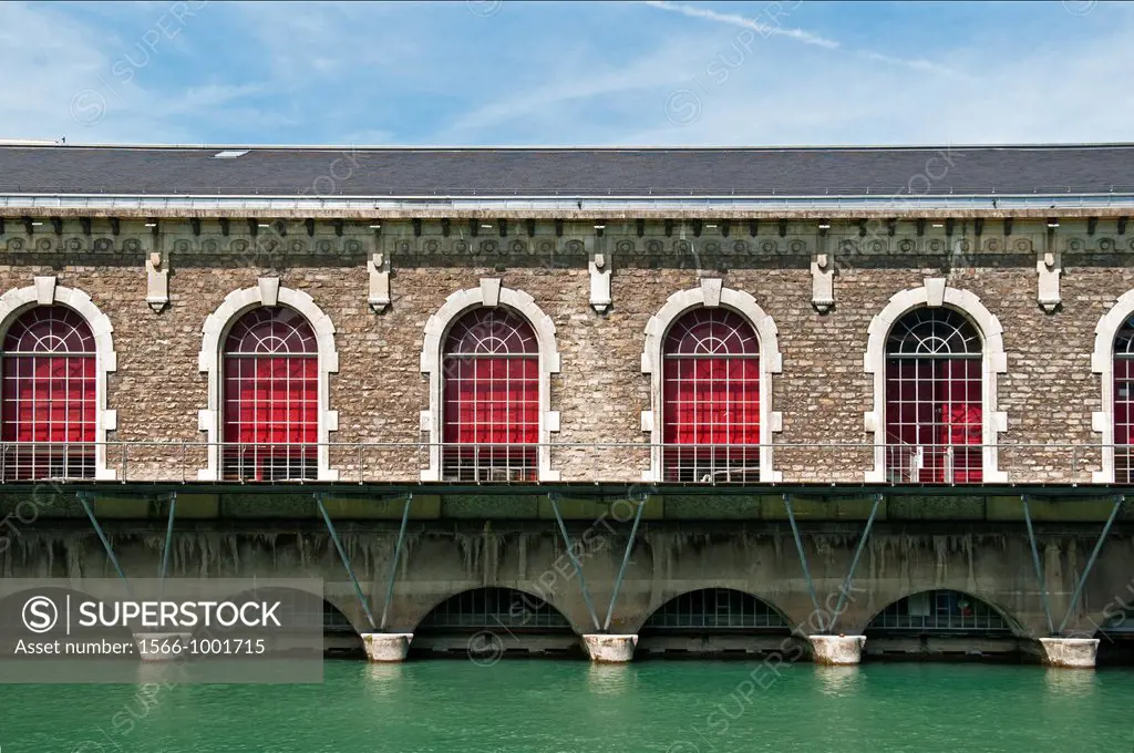 Famous Batiment des Forces-Motrices, BFM, Rhone river, historic former hydroelectric power plant, presently second Opera House in Geneva, Switzerland,...