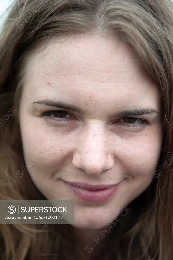 Rotterdam, Netherlands. Close-up portrait of an attractive, young adult brunette woman.