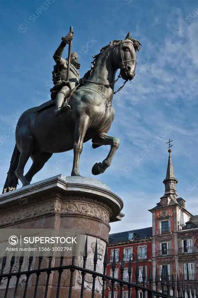 Statue of Philip III with the Casa de la Panaderia in the background in the Plaza Mayor, central Madrid, Spain