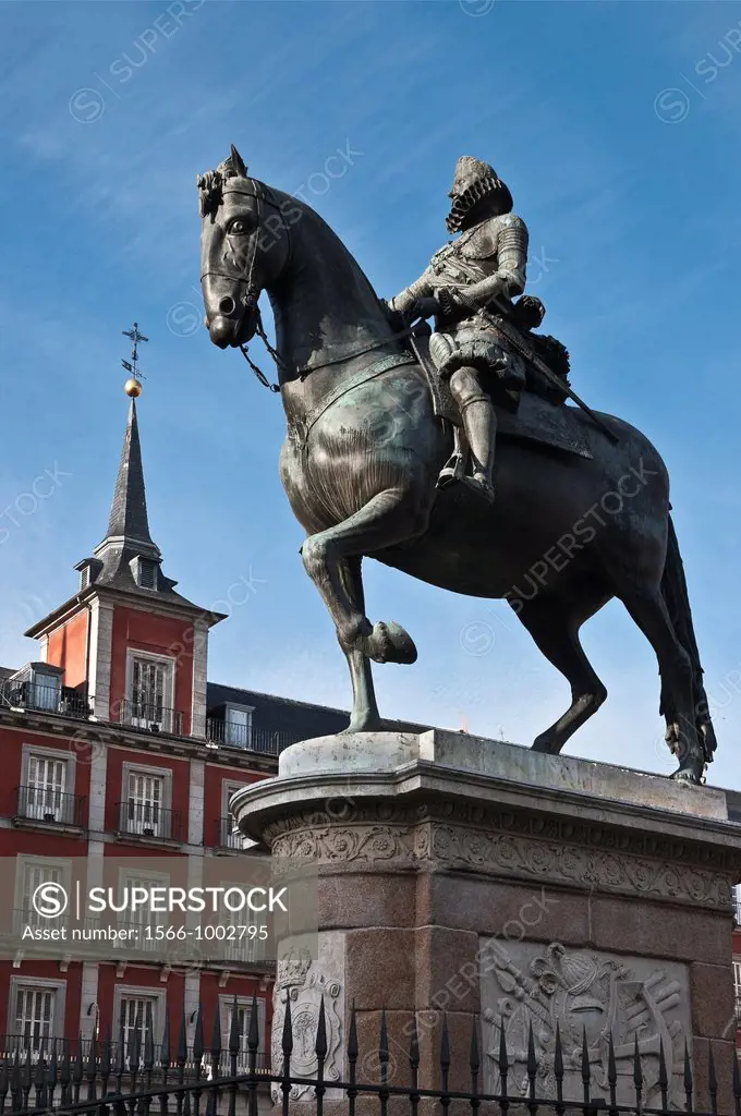 Statue of Philip III with the Casa de la Panaderia in the background in the Plaza Mayor, central Madrid, Spain