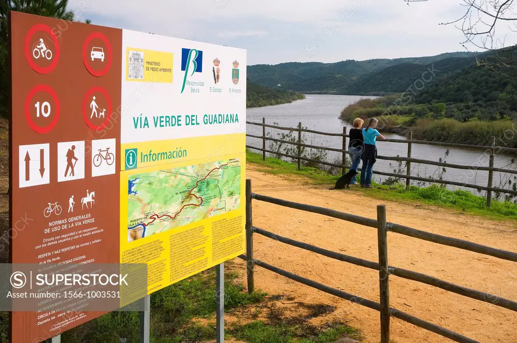 Vía verde del Guadiana-placard and tourists, El Granado, Huelva-province, Spain,        