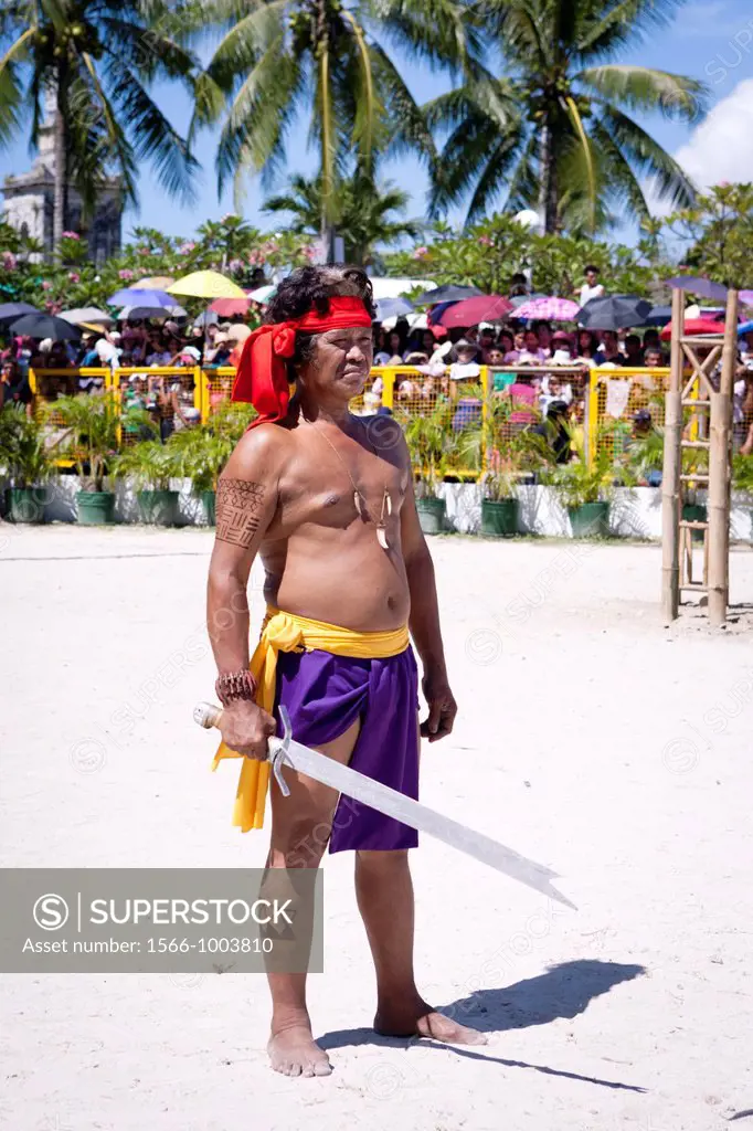 The warriors of Lapu-Lapu, a native chieftain of Mactan Island, getting ready for the battle at the Battle of Mactan reenactment or Kadaugan Festival ...