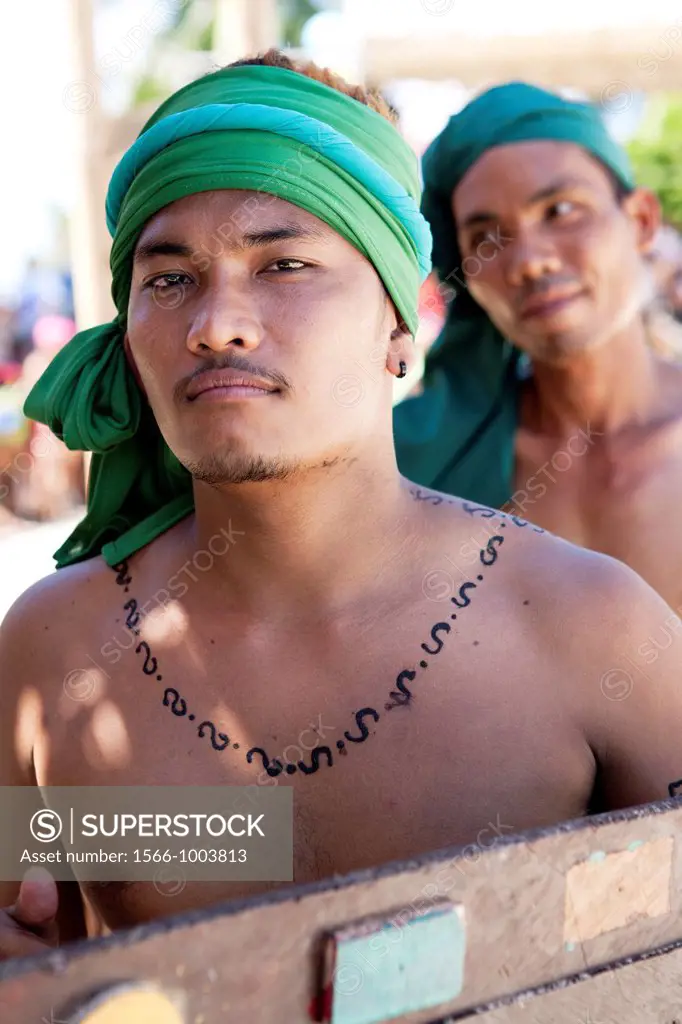 The warriors of Lapu-Lapu, a native chieftain of Mactan Island, getting ready for the battle at the Battle of Mactan reenactment or Kadaugan Festival ...
