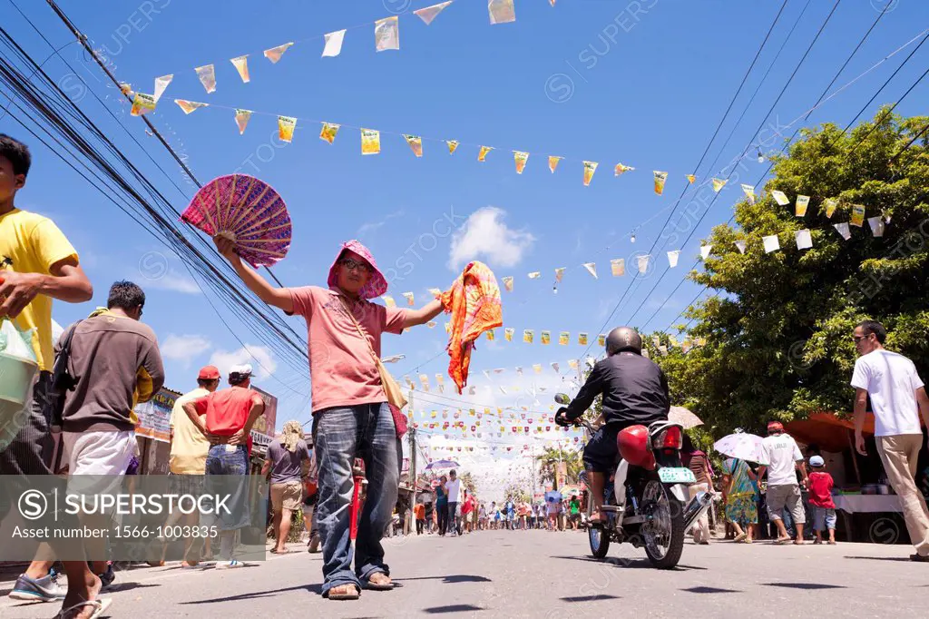 Street vendor with his goods during the annual Battle of Mactan reenactment or Kadaugan Festival  The Battle of Mactan was fought in the Philippines o...