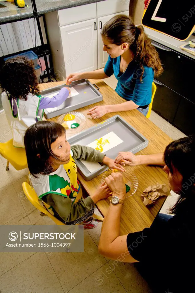 A teacher watches as blind children use yellow and green gel to signify lemon and lime -- both starting with the letter ´L´ -- to form the letter ´L´ ...